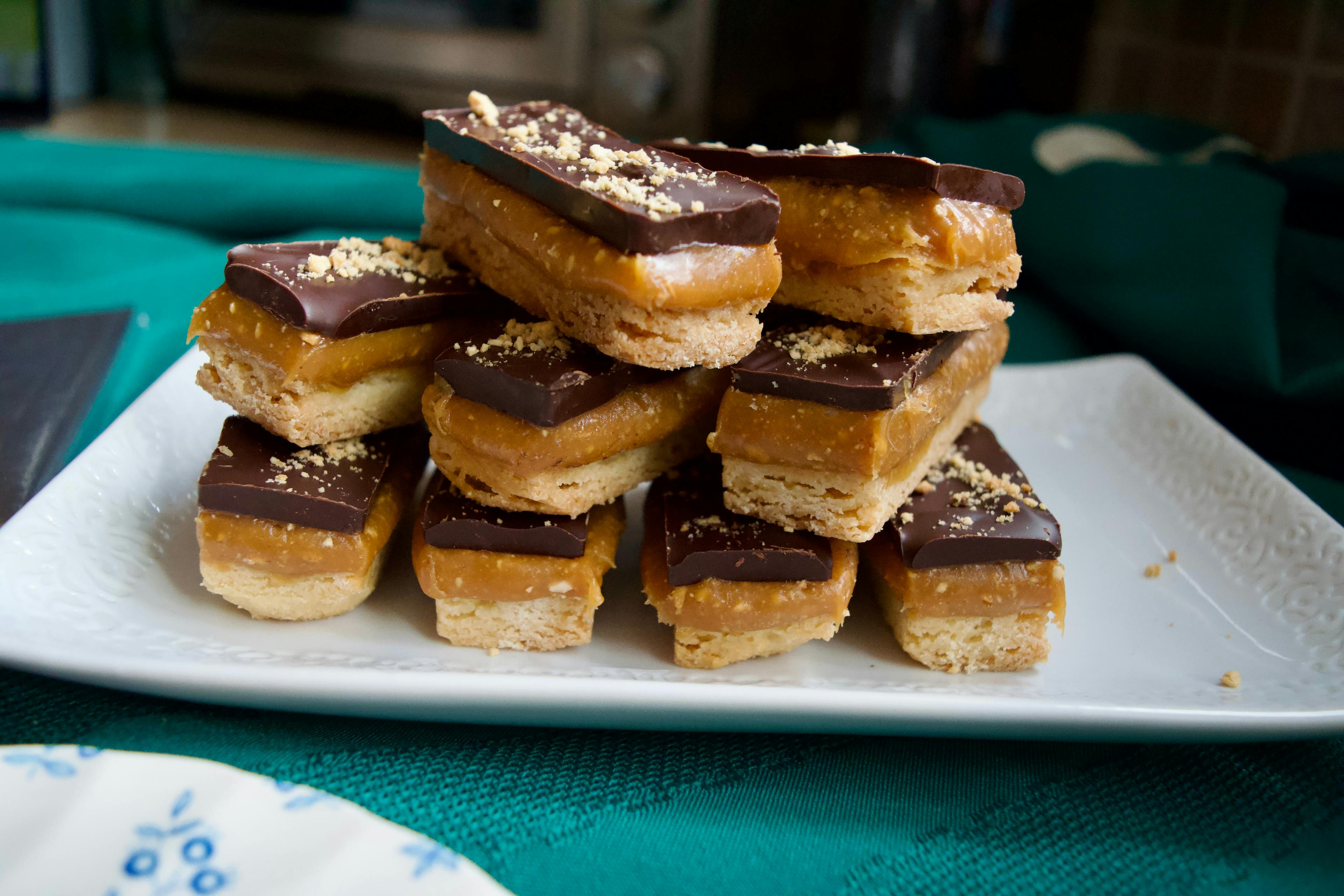 A plate of layered millionaire shortbreads