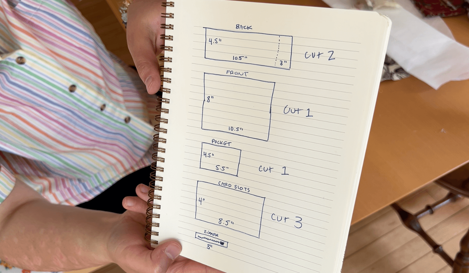 A note book page showing all the measurements for the pieces